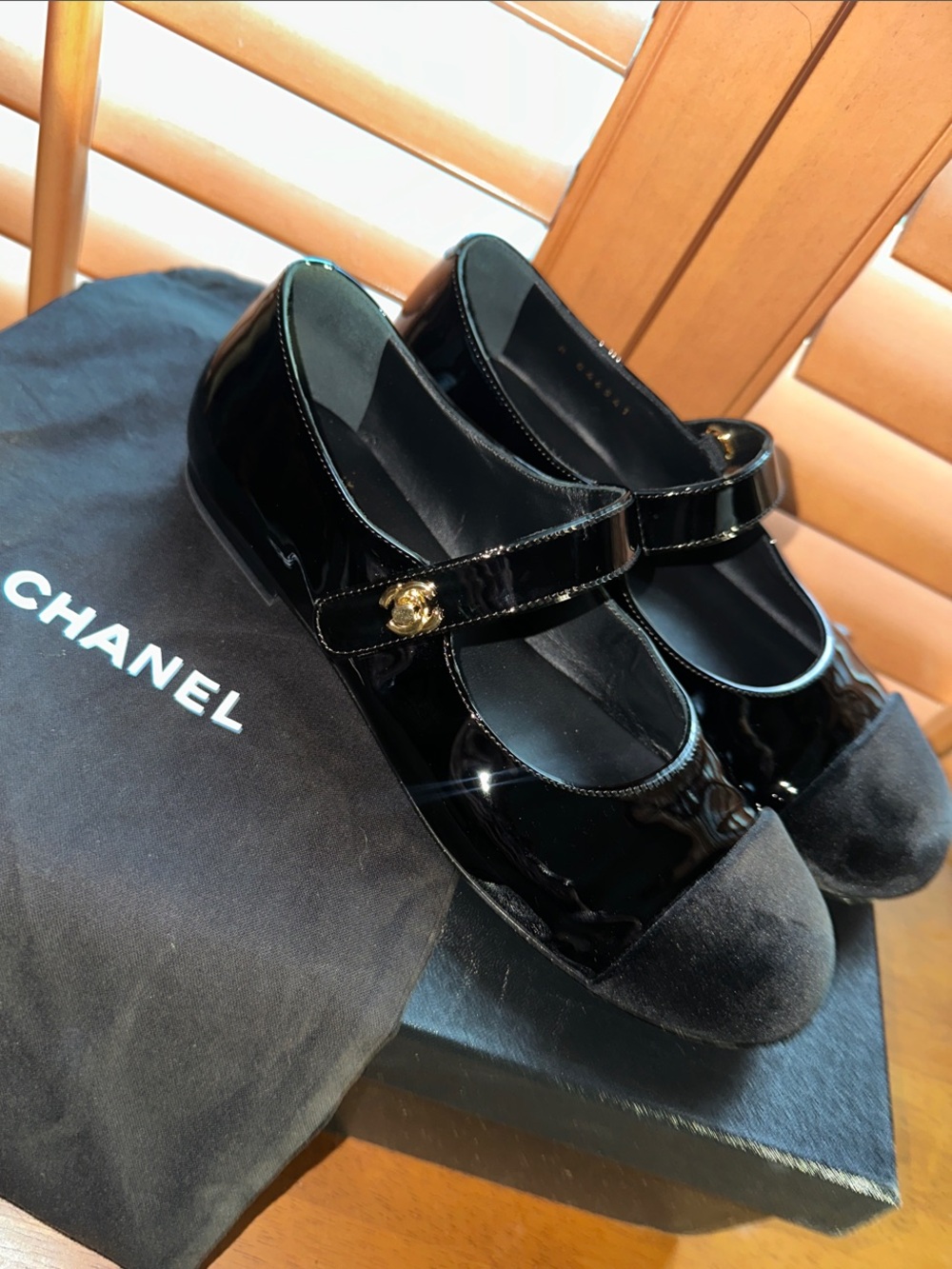 CHANEL Black Patent Mary Jane Flats with Suede Cap Toe and Gold CC Button